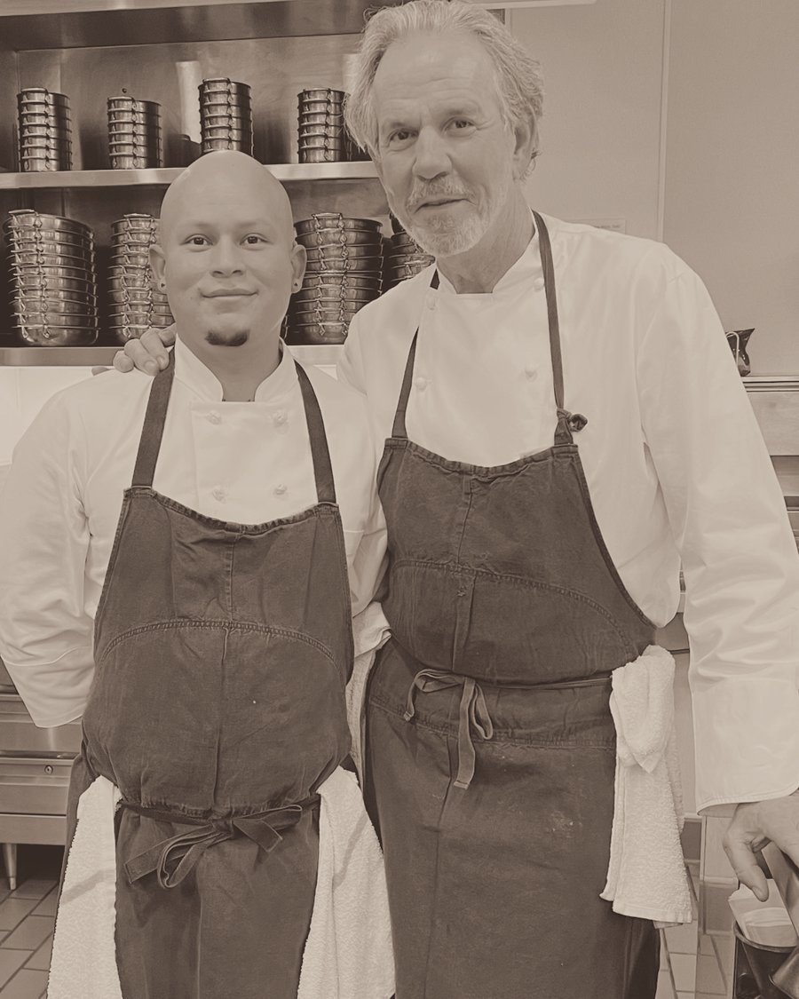 Michael Palomino with Chef Thomas Keller in the kitchen at Bouchon